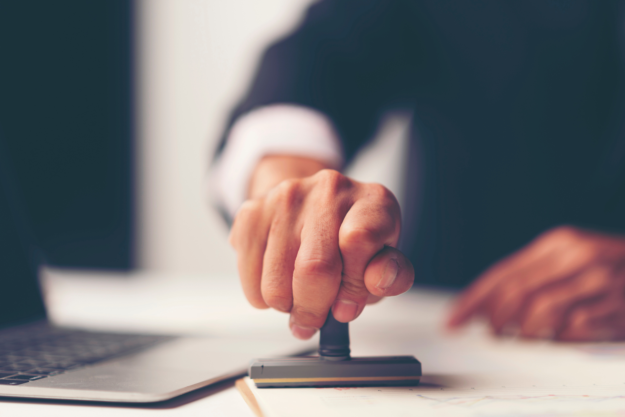 Midsection Of Lawyer Working At Desk In Office